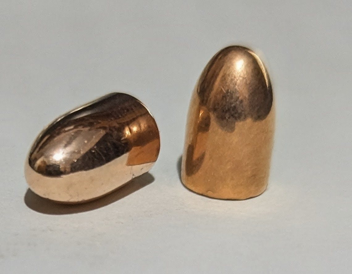 Two Lead and Copper 9mm copper-plated projectiles